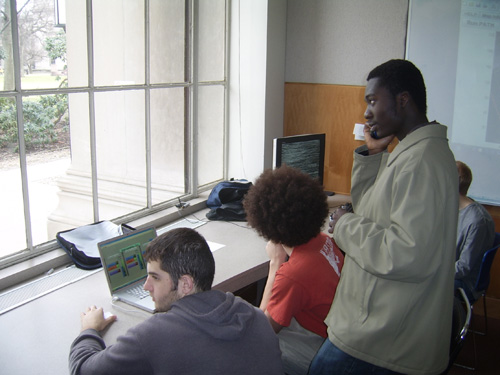 Crew members in headquarters using computers and walkie-talkies.