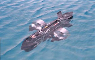 Photo of ORCA-1, an autonomous submarine, in water.