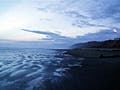 Ocean waves breaking on a beach. 