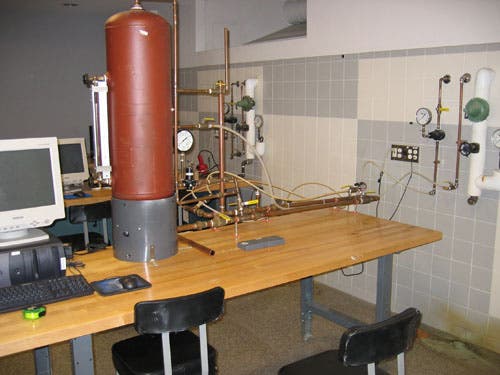 Lab 2 apparatus (left to right): computer for instrumentation and data capture, storage tank, transfer line system connected to lab's pressurized air supply.