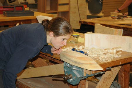 A student sites the underwater shape of her hull model.