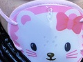 A photo of a girl with a medical face mask featuring a cat.
