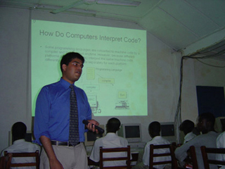 MIT student teaching African students.