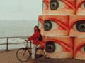 An animated gif of photos of street scenes and public art.