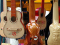 A photo of a stand selling handmade musical instruments.