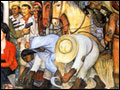 A photograph of a gigantic wall-size mural depicting various scenes representing Mexican history.