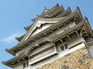 roof of an oriental structure in a blue sky background