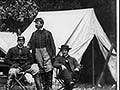 A photograph of civil war soldiers sitting in a camp.