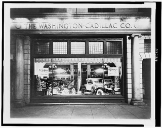 Black and white photo of a card dealership.