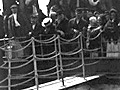 Black/white photo of immigrants on steerage deck of ship.