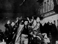 A photograph of jewish civilians during the destruction of the Warsaw Ghetto, 1943.