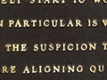 Plaque showing a Jenny Holzer poem engraving.