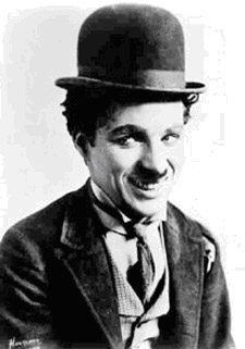 Portrait photo of Charlie Chaplin wearing his signature bowler hat.