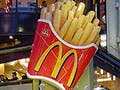 A photo of a McDonald's in Tokyo, Japan with passersby in the foreground.