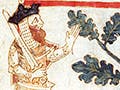 Color illustration of King Arthur finding a giant roasting a pig that was drawn in the margins of the text, Roman de Brut, by Wace.