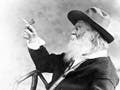 Photo of Walt Whitman holding butterfly.
