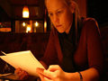 Photograph of a woman reading a script.