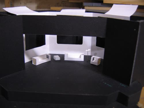 The furniture in this set includes two couches, an endtable, a lamp, and a low-backed armchair.