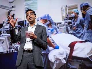 A photo of Atul Gawande, who is a well known surgeon and science writer, speaking at a TED conference.