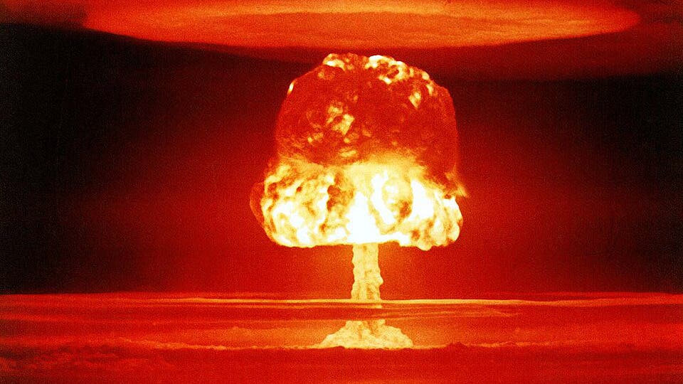 A red-glowing mushroom cloud from the Castle Romeo test.