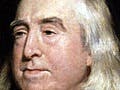 An elderly white man with long grey hair.