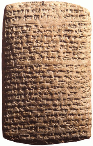 A baked clay tablet with Akkadian cuneiform.