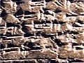 A baked clay tablet with Akkadian cuneiform.