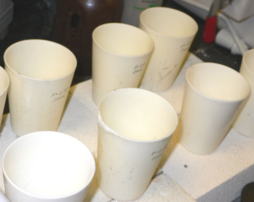 Glass-filled crucibles ready for heating.