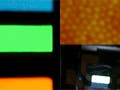 Three images, left side photo of quantum dot color blocks of violet, blue, green, orange, and red; upper right is a single layer of quantum dots orange-yellow in color, and the bottom photo captures the white light flash emitted from quantum dots.  