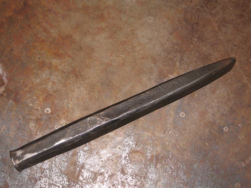 Punches are 6" long, 1/2" wide, and have a flat head for hammering. This one is square-sided, and the end is a straight point the width of the stock.