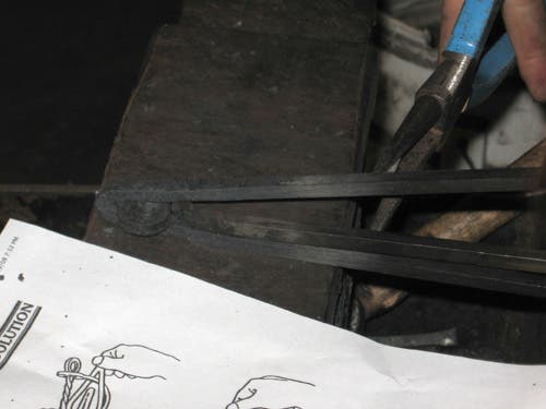 Based on the instruction sheet, the scroll needs to pass through the point.