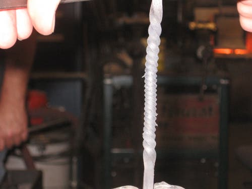The finished twist may be tight or loose, depending on how fast the curve is cranked, how much metal was heated, and how much was free outside the clamp.