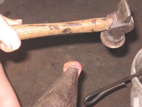 Widening the hole using the anvil horn.