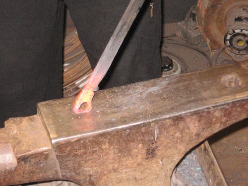 The melted metal at the end of the opener is so weak, it can be deformed just by pressing it against the anvil face.