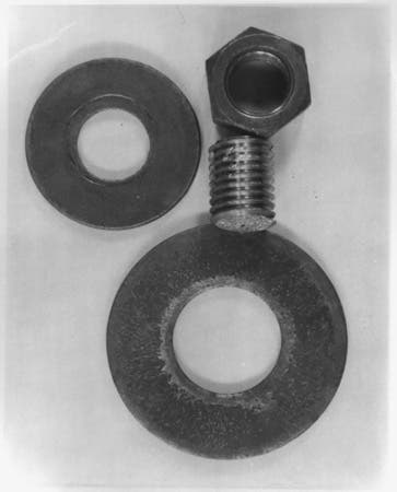 Photo of fractured bolt and some nuts.