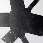 Drawing of a polygonal all-like figure with faces called out by projection lines.