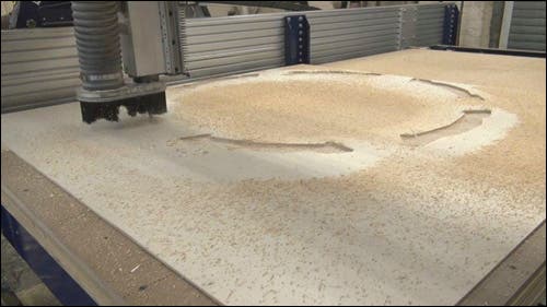 Wooden board on a CNC router.