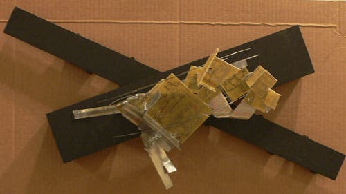 A junk model, made from found objects, starts to define the spac