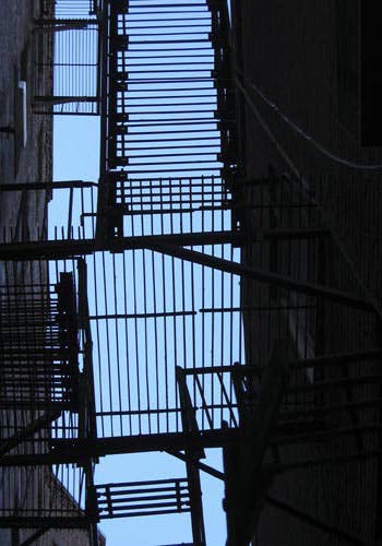 An image of the Space Between:  A fire escape between buildings in Boston's North End.