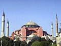 A large brick Byzantine cathedral, now a museum,  with dome and four minarets.