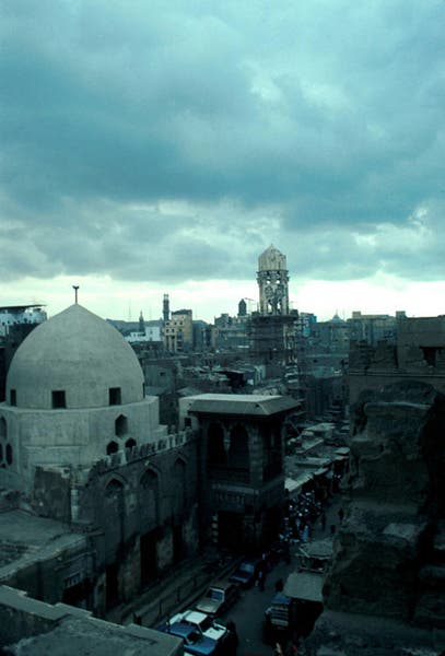Image of Contemporary view with the dome and minaret and the shops hiding the facade.