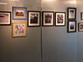 Student artwork on display in a gallery.