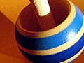 Toy top, tilted while spinning