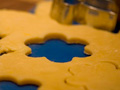 Photograph of a cookie cutter and cookie dough.