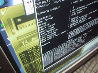 Photo of a computer screen showing several overlapping applications.