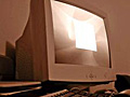 A sepia toned photograph of a personal computer.