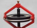 Rotating gyroscope on the top of a nail.