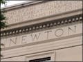 A photo of a building with the word "Newton" engraved on the side.