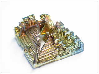 An irridescent synthetic bismuth crystal.