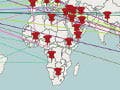 A world map where each of the continents have several push pin icons on them. The various push pins are connected to each other with multi-colored lines.